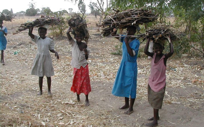 32A girls carrying wood - not at school